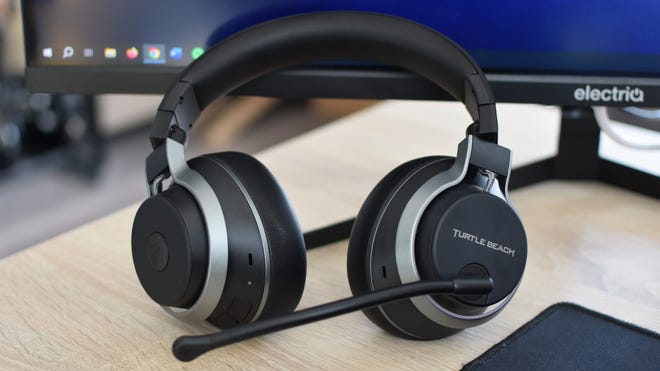 The Turtle Beach Stealth Pro gaming headset propped up against a desktop monitor.