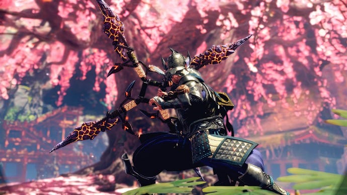 Wild Hearts image showing a player wearing Samurai armor and wielding a big bow, with a blossom tree in the background.