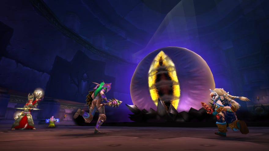 Some characters rush towards a glowing Sauron-style eye in World Of Warcraft Classic.